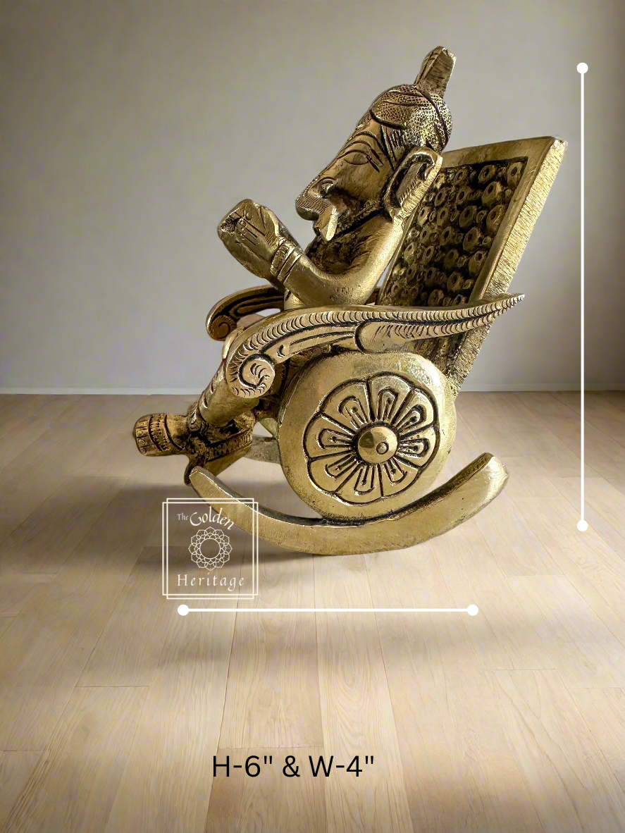 Ganesha sitting on rocking chair & reading book - The Golden Heritage #