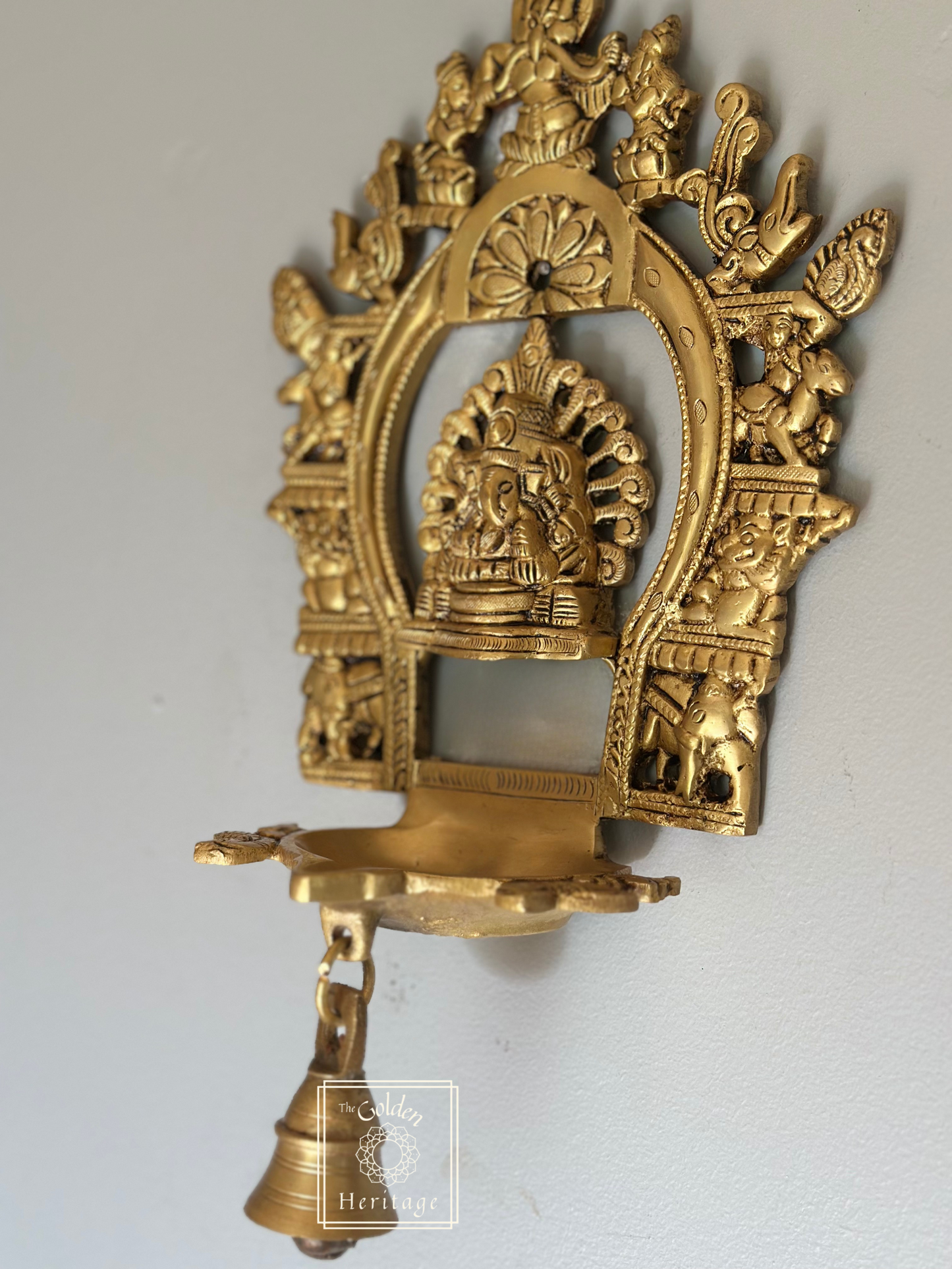 Sukhasana Ganapati with Prabhavali frame Diya
