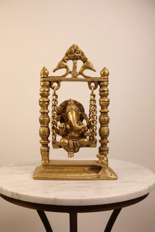 An ornate brass Ganesha swing decoration. Ganapati Jhoola for your home decoration.