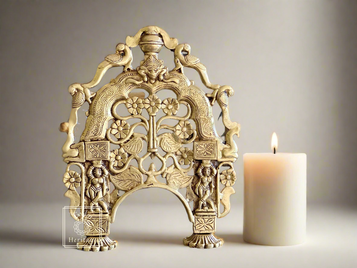 A brass Prabhavali frame with intricate designs, likely used for home decor purposes.
