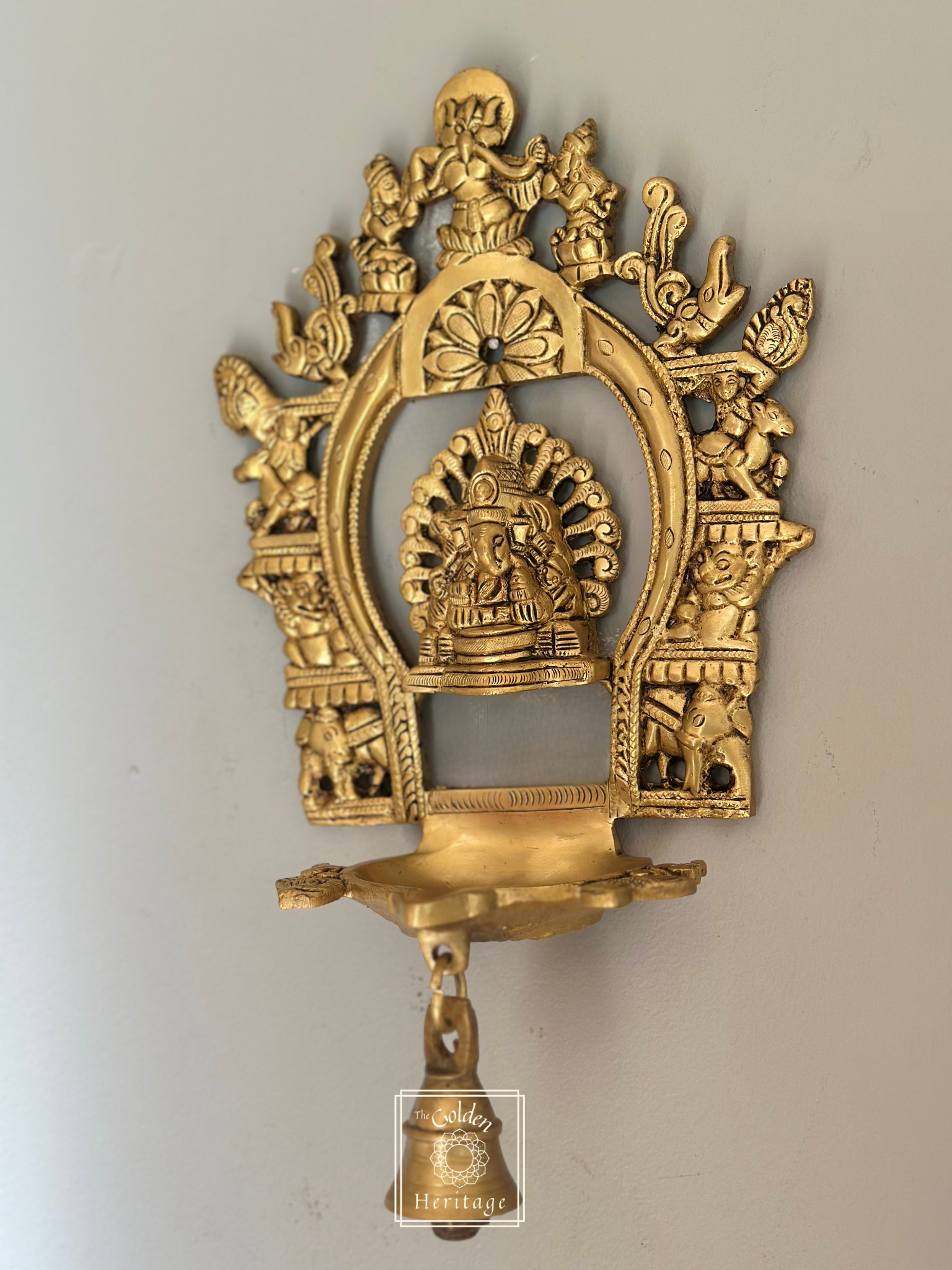Sukhasana Ganapati with Prabhavali frame Diya