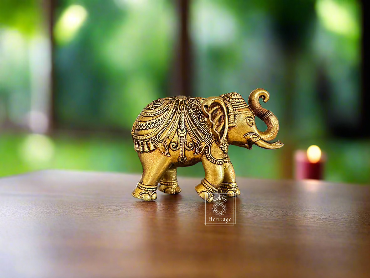 Handmade brass elephant figurine symbolizing strength and wisdom, perfect for home decor. Height: 6 inches, Width: 4 inches.