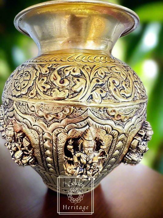 A detailed brass Kalash with floral and traditional Hindu motifs, AshtaLaxmi symbolizing prosperity and abundance.