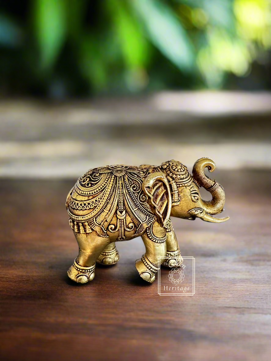 Handmade brass elephant figurine, symbolizing strength and wisdom, perfect home decor accent.