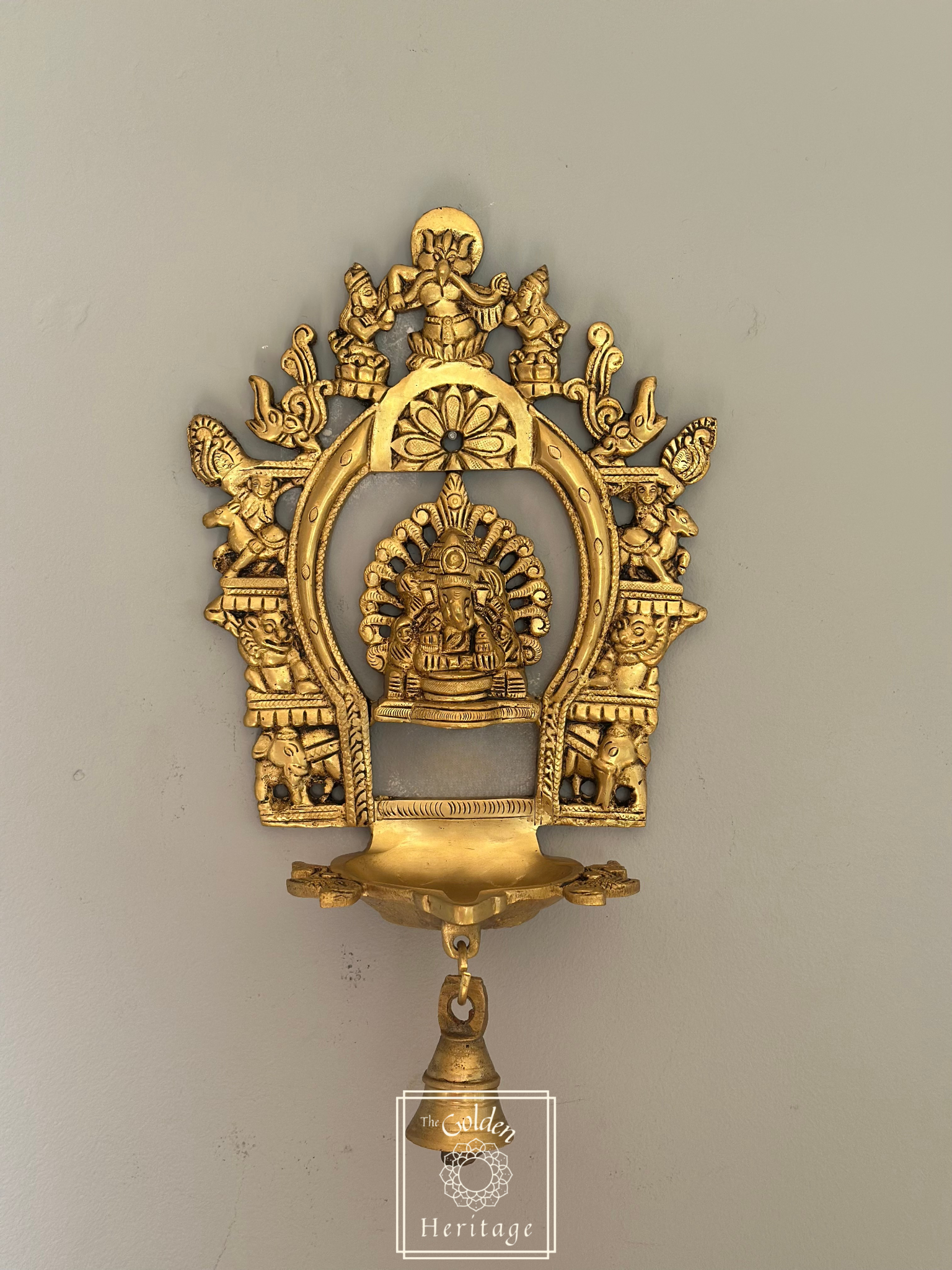 Sukhasana Ganapati with Prabhavali frame Diya